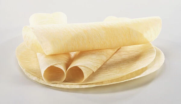 Spring roll wrappers, flat and rolled up