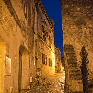 France, Provence, Les Baux-de-Provence. Deserted street inside castle at night. Credit as