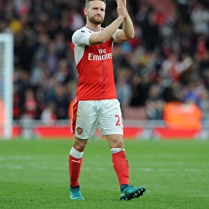 Arsenal's Mustafi Celebrates with Fans: Arsenal's Victory over Swansea City (2016-17)