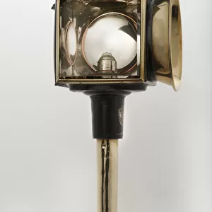 Candle powered carriage lamp 1900. Creator: Unknown