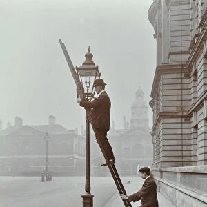 Testing gas pressure in street lighting, Westminster, London, 1910