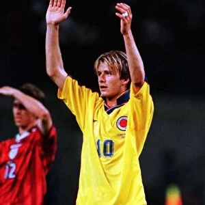 David Beckham arms aloft wearing Colombian shirt Jun 98 after Englands