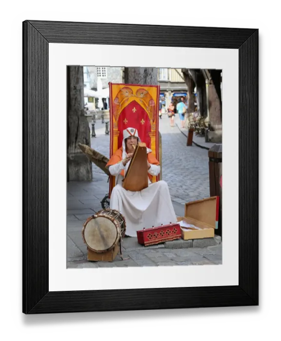 Framed Print : Medievial busker, Dinan, Brittany, France Framed Print : Medievial busker, Dinan, Brittany, France