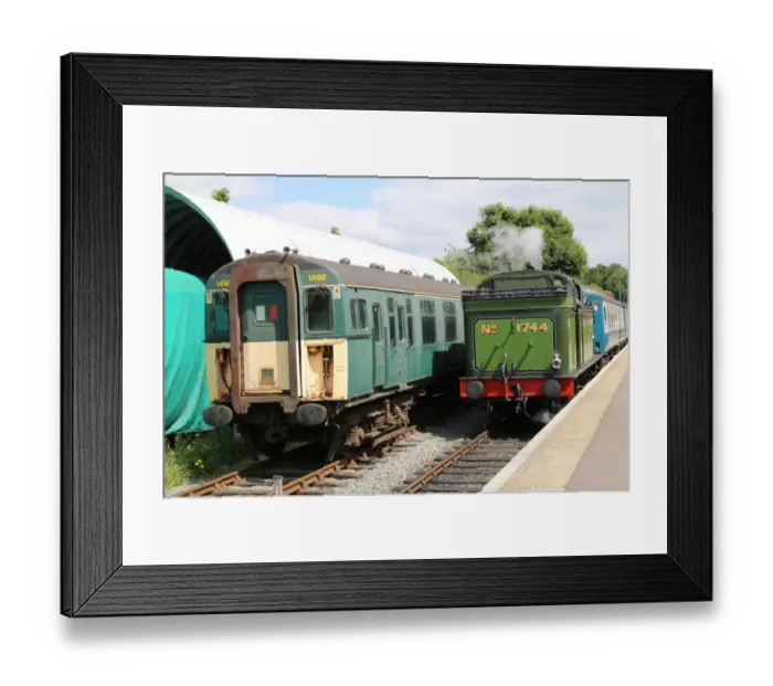 Framed Print : Steam engine and electric train at Ongar Station, UK