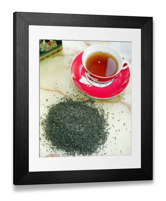 Framed Print : Cup of black tea with tea leaves Framed Print : Cup of black tea with tea leaves