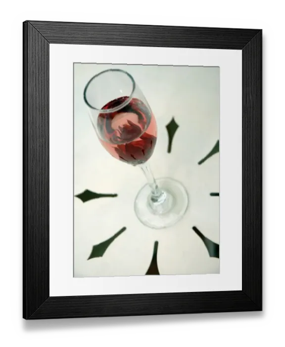 Framed Print : Wine glass with flower petals inside Framed Print : Wine glass with flower petals inside