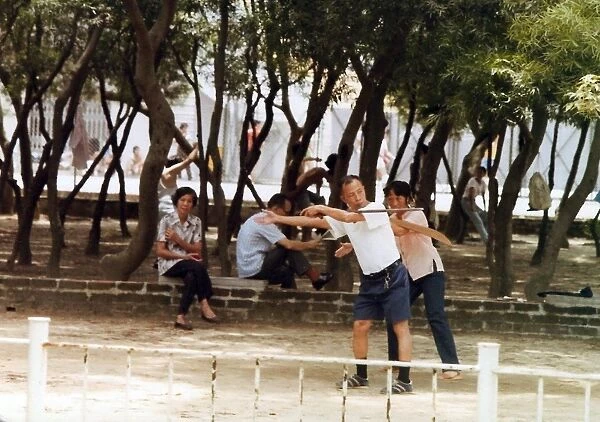 Chinese people shadow boxing in the park in Hong Kong