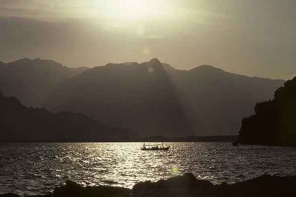 Fishing boat with a backdrop of Taurus mountains, Antalya