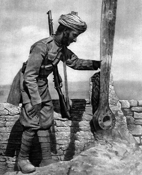 An Indian soldier pays homage to British airmens grave