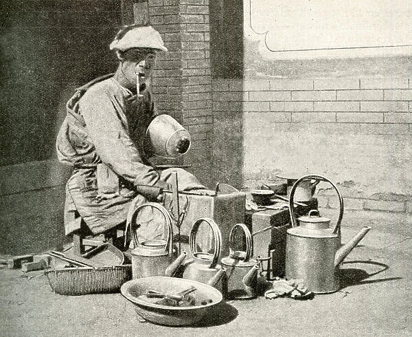 Itinerant tinker with pots and pans, China, East Asia