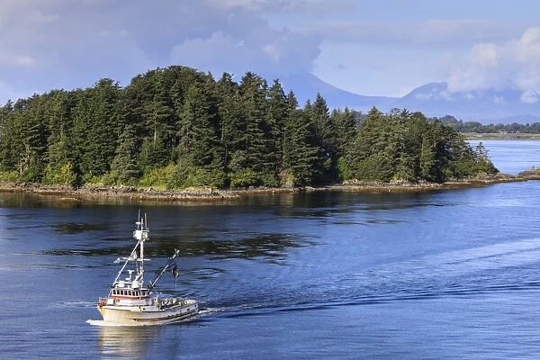 Commercial fishing boat and small forested island, rare summer sun, Sitka Sound, Sitka