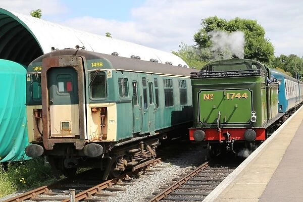 Steam engine and electric train at Ongar Station, UK