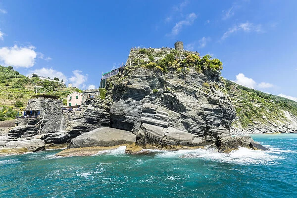 Turquoise sea frames the fortress perched on promontory Cinque Terre National Park