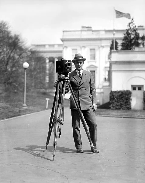 PHOTOGRAPHER, c1915. A photographer with his camera and tripod, outside the White