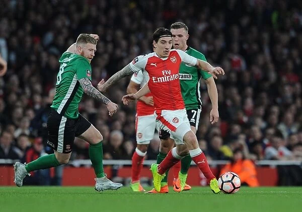 Arsenal's Hector Bellerin Faces Off Against Lincoln City's Alan Power in FA Cup Quarter-Final Showdown