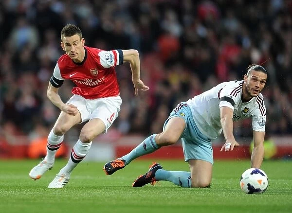 Arsenal's Koscielny Brushes Off Andy Carroll's Challenge During Arsenal v West Ham United (2013 / 14)