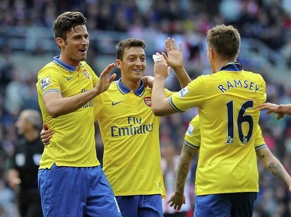 Arsenal's Triumph: Ramsey, Giroud, Ozil Celebrate Goals Against Sunderland (2013-14)