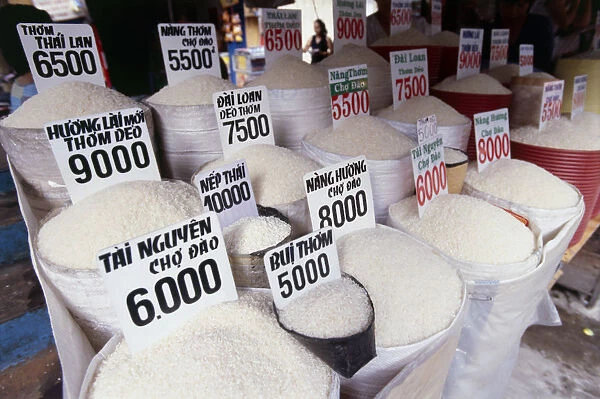 Various types of white rice in sacks at market in Ho Chi Minh City