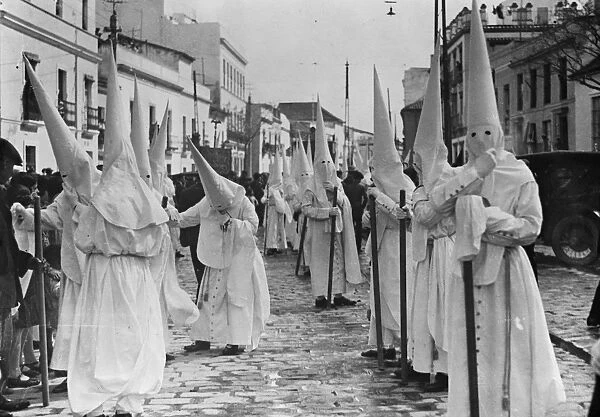Holy week in Seville. One of the brotherhoods with the Nazarenes. 22 March 1929