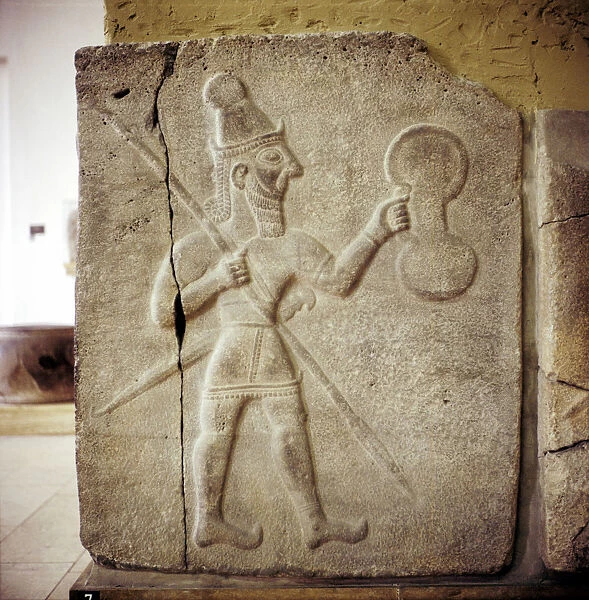 Hittite relef of a Hittite warrior or war-god with shield spear and sword