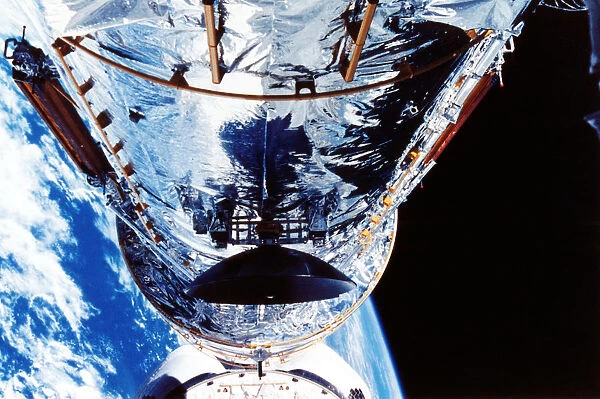 The Hubble Space Telescope orbiting the Earth, c1990s