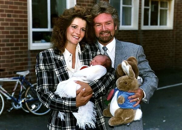 Noel Edmonds TV Presenter and Personality with wife Helen and baby daughter Olivia