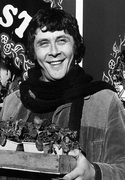 Richard Beckinsale actor with pot plants Circa 1979