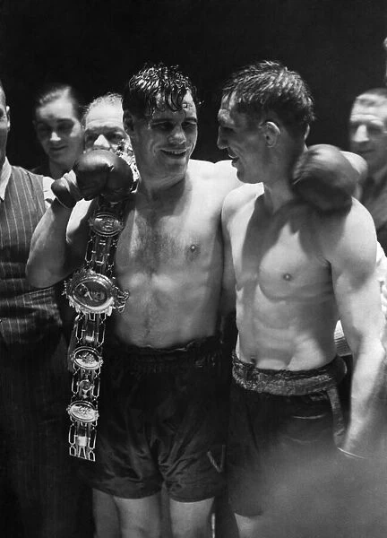 Vince Hawkins, the winner, holding the Lonsdale belt, with Ernie Roderick looking