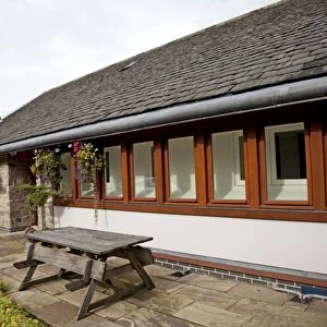 Eco-friendly Home - highly energy efficient bungalow with additional wall built of straw bales and rendered - UK