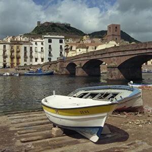 Boats beside a bridge over the Temo River at Bosa on