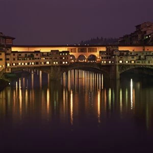Reflections in the River Arno of lights on the Ponte