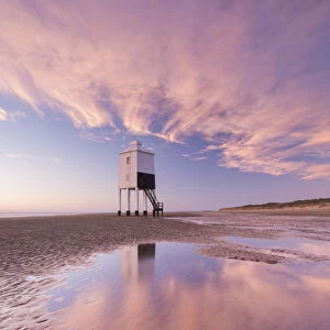 Wooden lighthouse and reflections on Burnham Beach at low tide, Burnham on Sea, Somerset