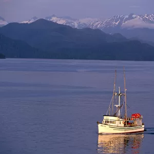 NA, USA, Alaska, Sitka, A fishing boat returns to Sitka; Baranof Island behind