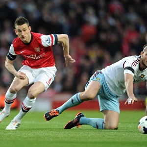 Arsenal's Koscielny Brushes Off Andy Carroll's Challenge During Arsenal v West Ham United (2013/14)