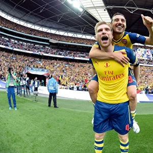 Arsenal's Per Mertesacker and Santi Cazorla Celebrate FA Cup Victory