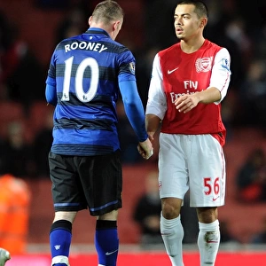 Nico Yennaris (Arsenal) shakes hands with Wayne Rooney (Man Utd) after the match