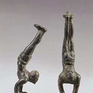 Pair of bronze statuettes of black acrobats walking on their hands, From Volubilis (Morocco)