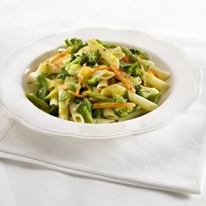 Penne primavera, spring green vegetable pasta, close-up