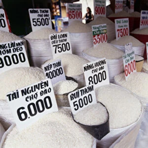 Various types of white rice in sacks at market in Ho Chi Minh City