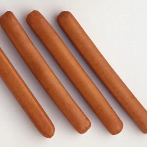 Above view of four frankfurter sausages