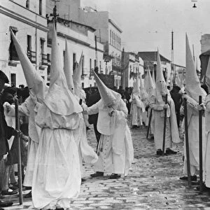 Holy week in Seville. One of the brotherhoods with the Nazarenes. 22 March 1929