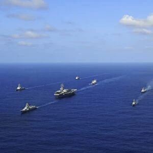 Ships from the Ronald Reagan Carrier Strike Group transit the Pacific Ocean