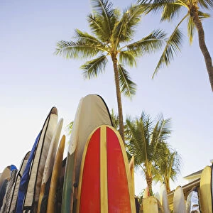 USA, Hawaii, Oahu, Close up view of colorful surfboards in surfboard rack on Waikiki Beach; Waikiki