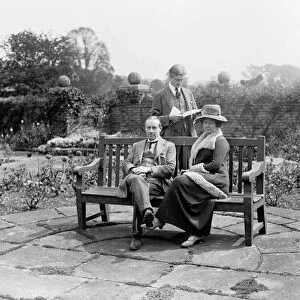 Prime Minister Stanley Baldwin with his wife Lucy and son Oliver in the garden at
