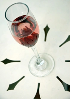 Wine glass with flower petals inside Wine glass with flower petals inside